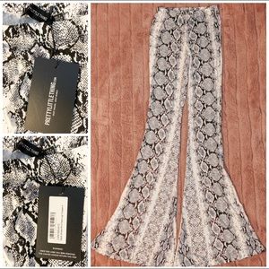 PrettyLittleThing black snakeskin flare pant